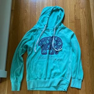 Brand is ocean drive, size large, color turquoise with navy blue writing